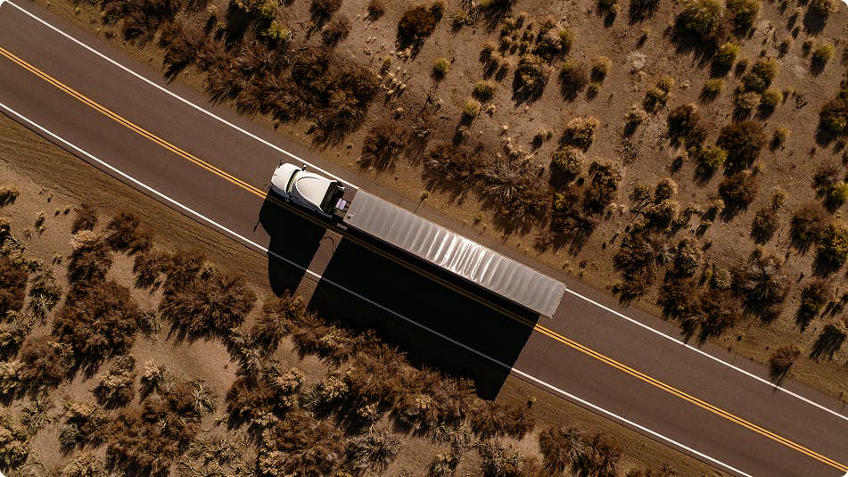 Bird's-eye view of a truck driving on a road