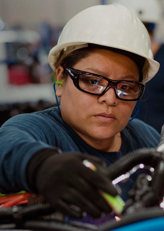An employee working at a factory