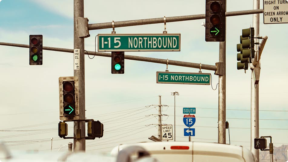 Traffic lights with a sign to enter the highway