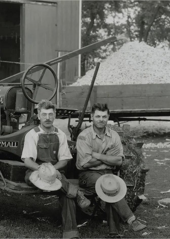 international men and tractor old black and white photo