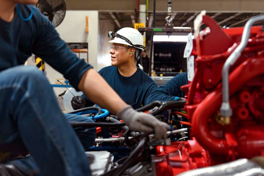 A group of men working on a machine