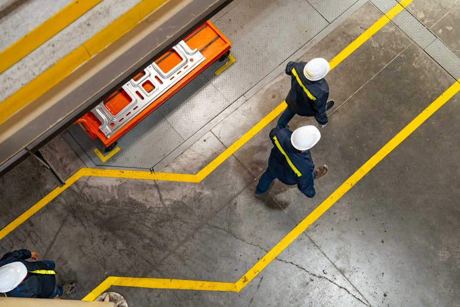 Bird's-eye view of employees walking in a plant.
