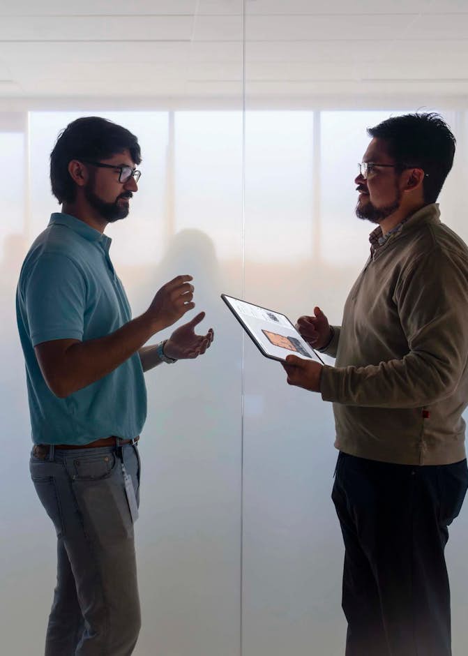 A couple of men standing in a room